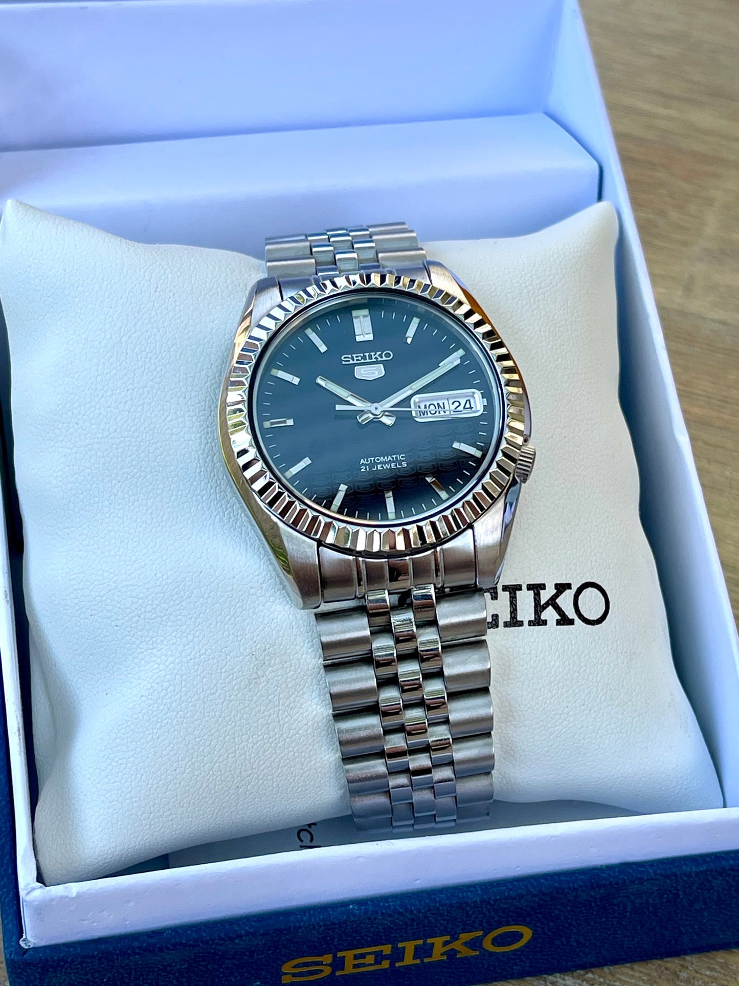 The "SEIKJUST" Genuine Seiko SNK w/ Dark Blue dial Modified - Datejust style with Sapphire crystal, Fluted Bezel, and Jubilee Style Bracelet
