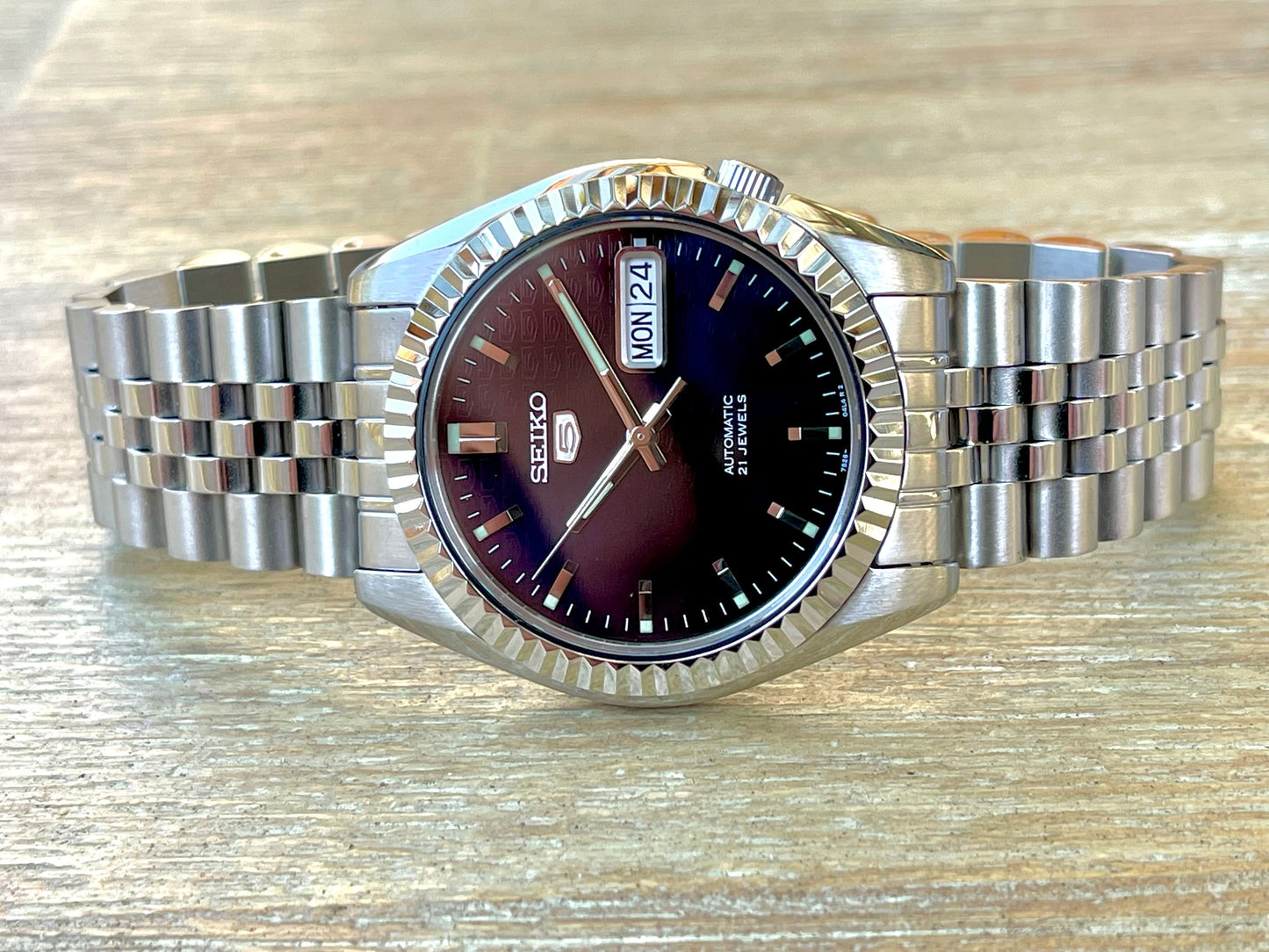 The "SEIKJUST" Genuine Seiko SNK w/ Dark Blue dial Modified - Datejust style with Sapphire crystal, Fluted Bezel, and Jubilee Style Bracelet