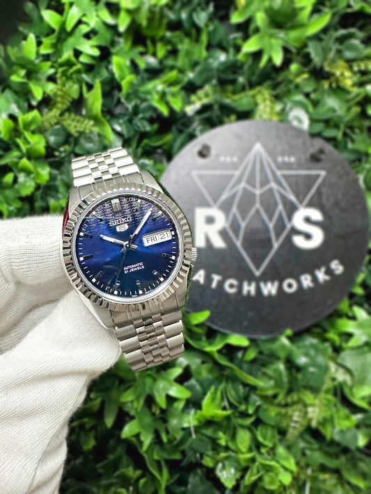 The "SEIKJUST" Genuine Seiko SNK w/ Dark Blue dial Modified - Datejust style with Sapphire crystal, Fluted Bezel, and Jubilee Style Bracelet