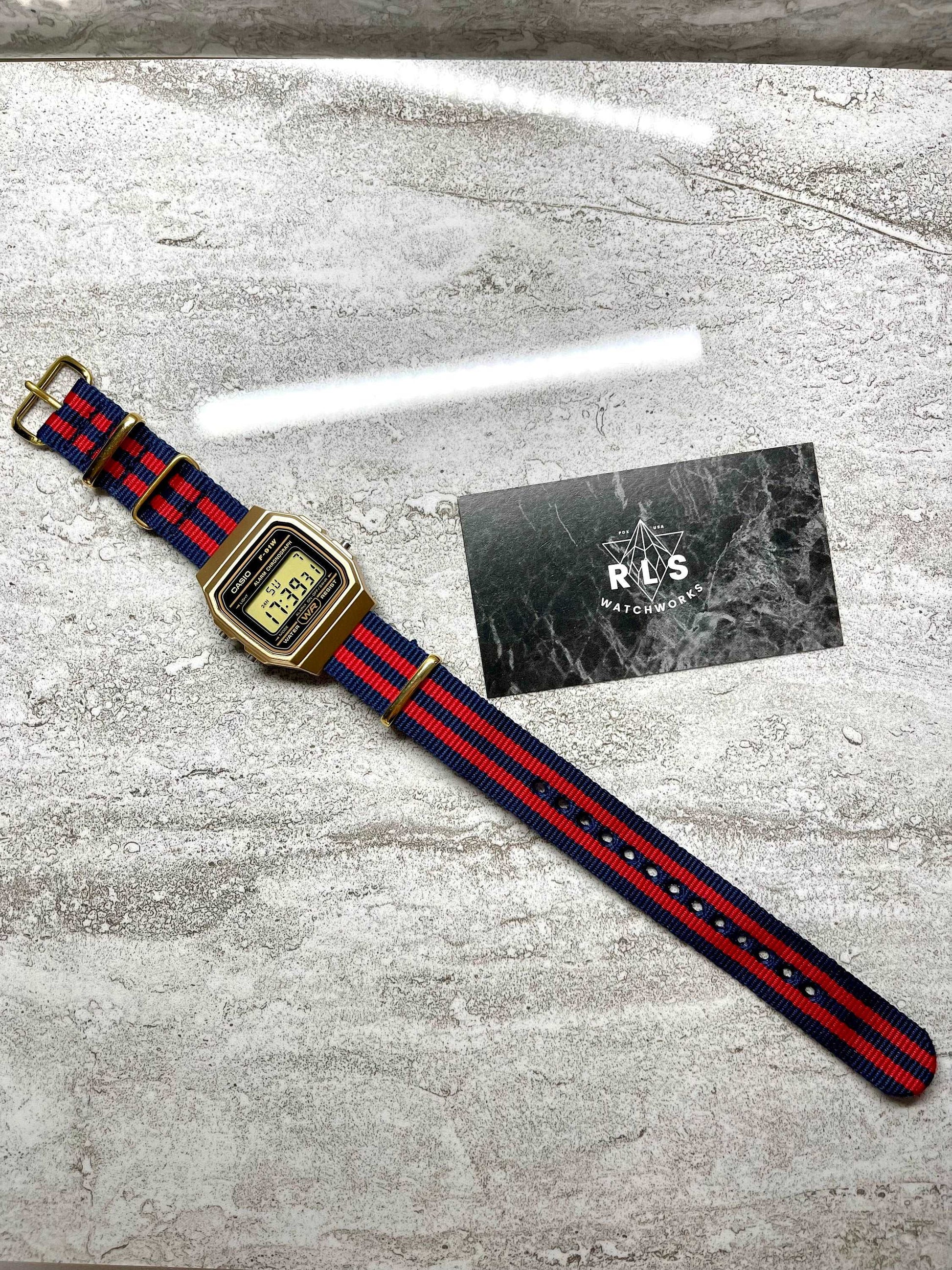 Custom Gold Casio Watch on Blue/Red Strap 