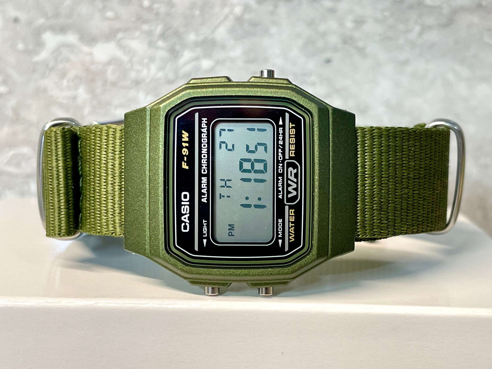 Modded Retro Casio F91W Watch, on a green NATO Strap
