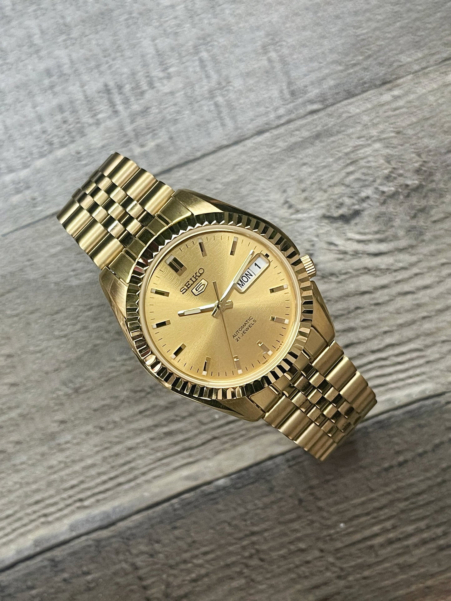 The "GOLD SEIKJUST" Genuine Seiko SNK w/ Gold dial Modified - Datejust style with Sapphire crystal, Fluted Bezel, and Jubilee Bracelet